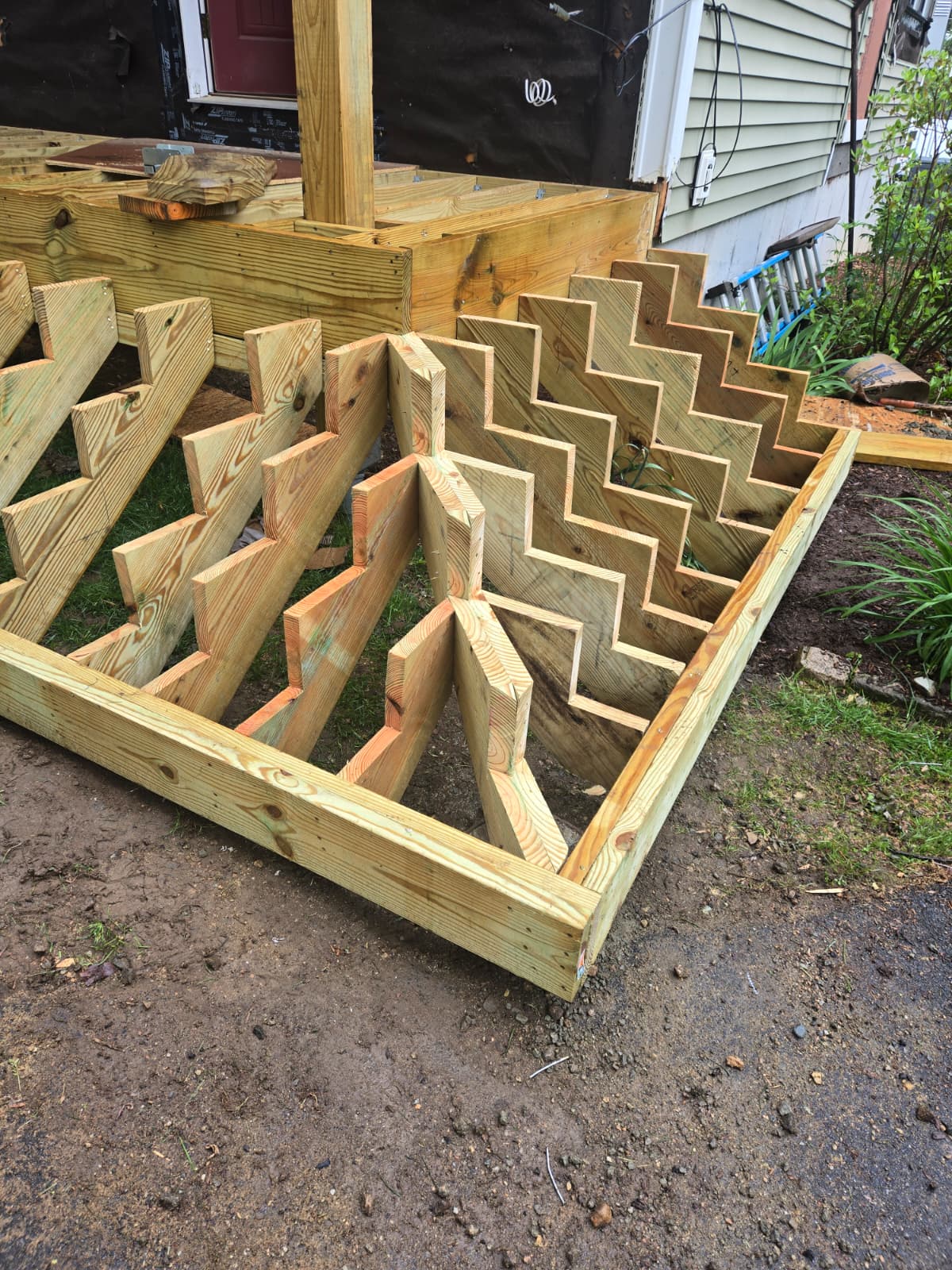 Precision wrap-around deck stair stringers cut by Pinheiro's Carpentry Inc
